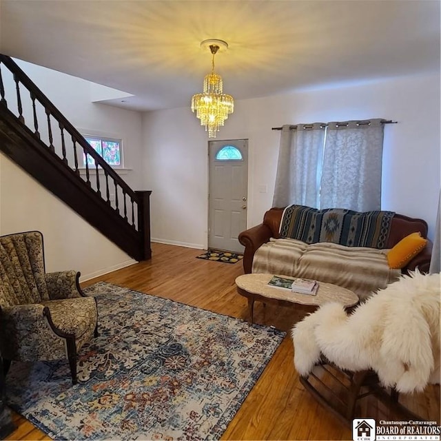 living room with a chandelier and hardwood / wood-style floors