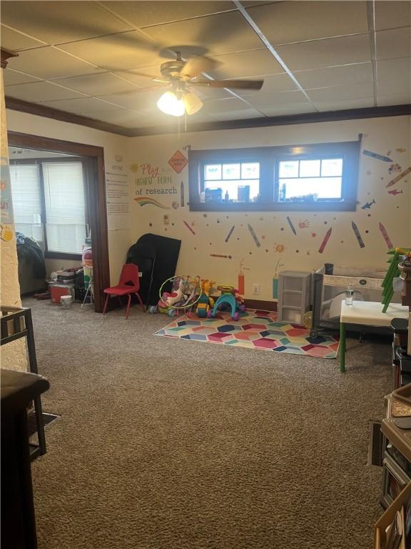 game room with carpet flooring and crown molding