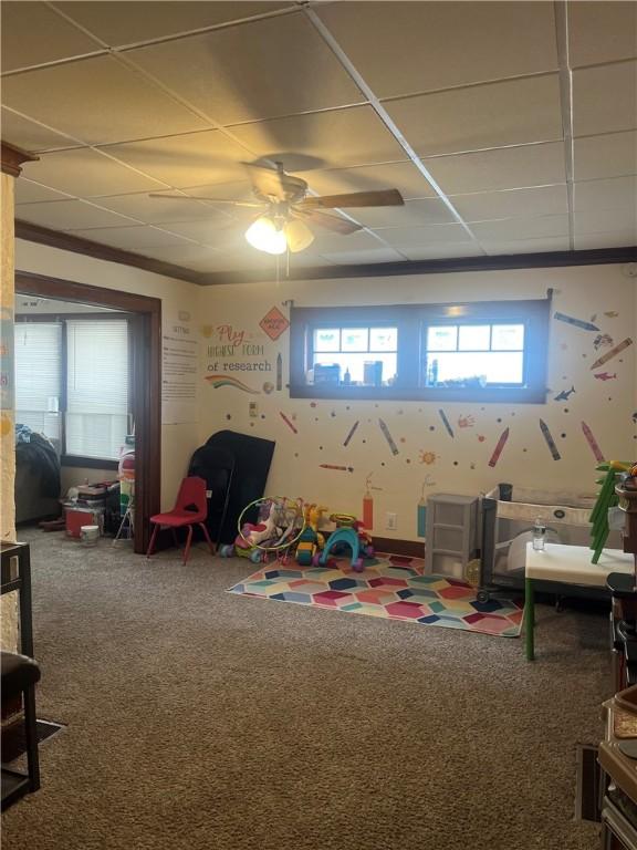 game room with carpet and crown molding