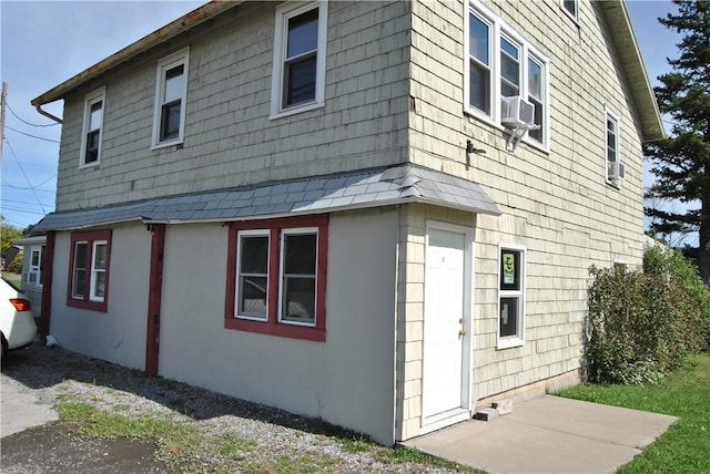 view of side of home with cooling unit