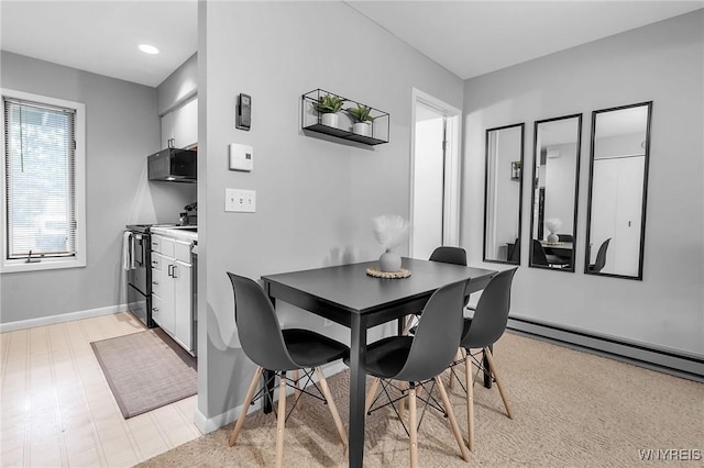 dining area featuring baseboard heating