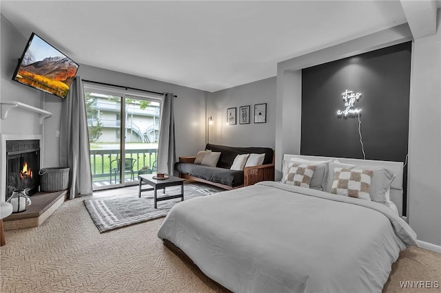 bedroom featuring carpet flooring and access to outside