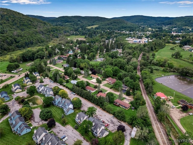 drone / aerial view with a water and mountain view