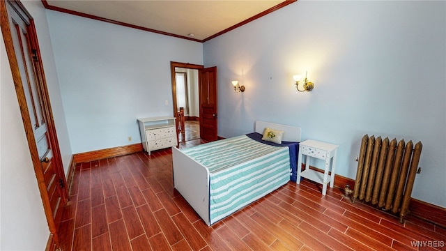 bedroom featuring radiator, dark wood-type flooring, and crown molding