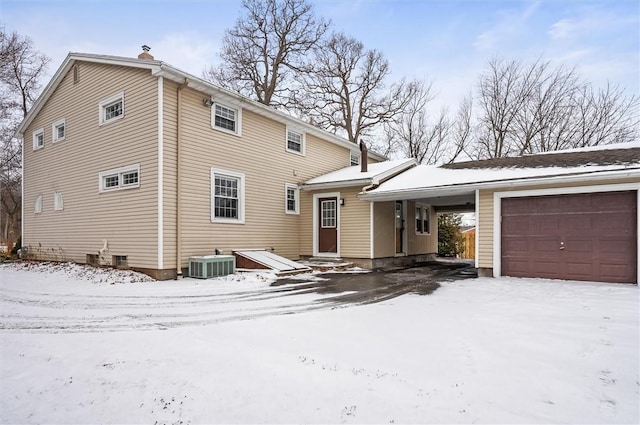 exterior space featuring a garage and central AC unit