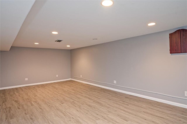 unfurnished room with light hardwood / wood-style flooring