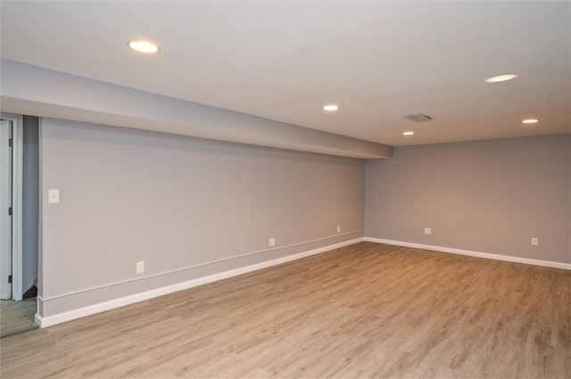 basement featuring light hardwood / wood-style flooring