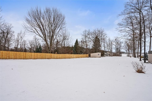 view of yard layered in snow