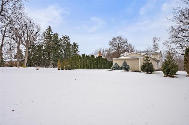 view of yard layered in snow