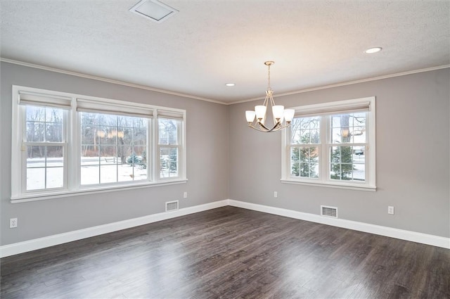 unfurnished room with dark wood-type flooring, a notable chandelier, and a textured ceiling