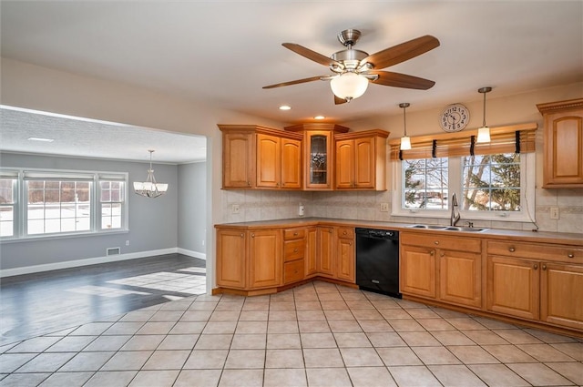 kitchen with decorative backsplash, sink, a wealth of natural light, and dishwasher