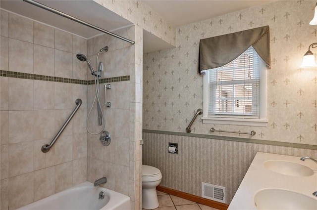 full bathroom featuring tile patterned floors, toilet, vanity, and tiled shower / bath