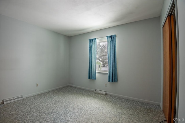 empty room featuring carpet flooring