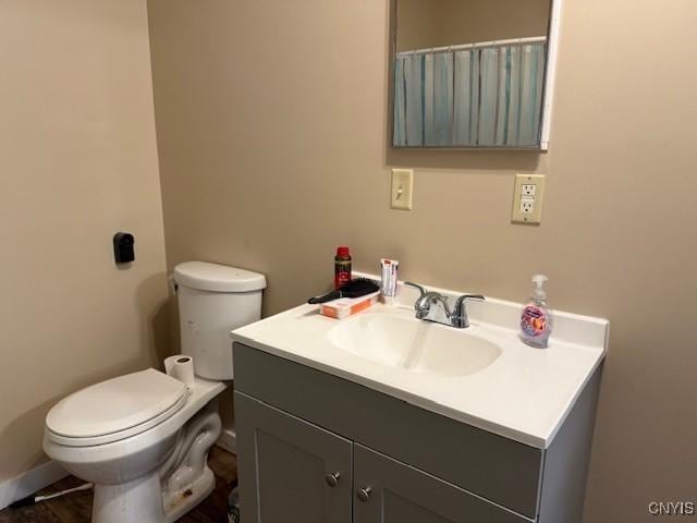 bathroom with toilet and vanity