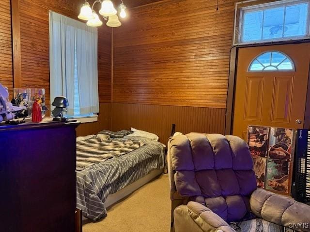 bedroom featuring carpet floors and wooden walls