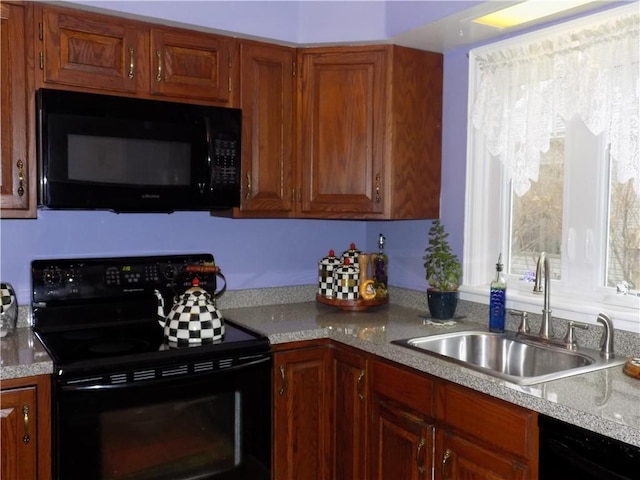 kitchen with black appliances and sink