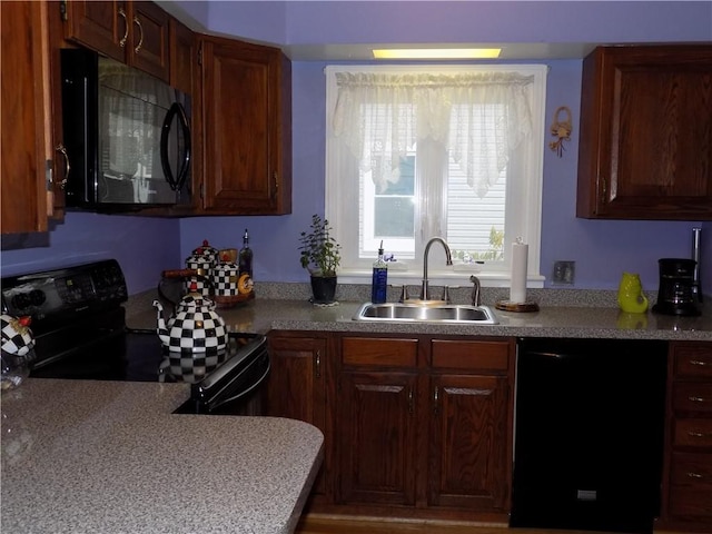 kitchen with black appliances and sink