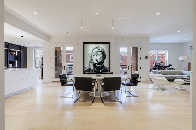 interior space featuring french doors and light hardwood / wood-style flooring