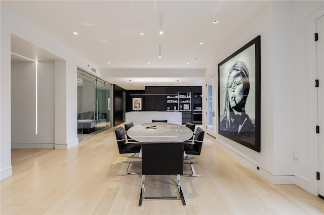 dining room featuring light hardwood / wood-style flooring