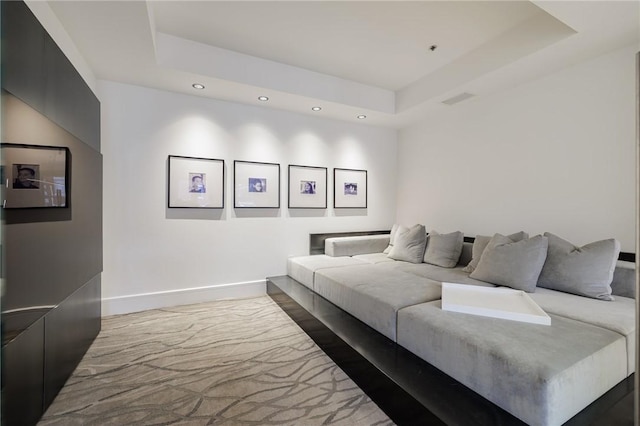 living room featuring a tray ceiling