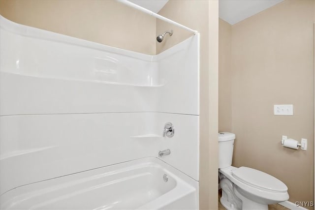 bathroom featuring toilet and tub / shower combination