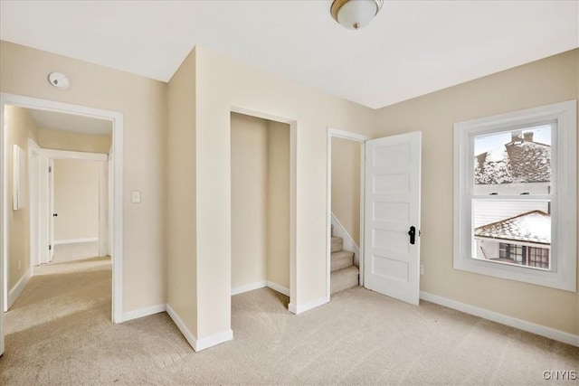 interior space featuring light colored carpet