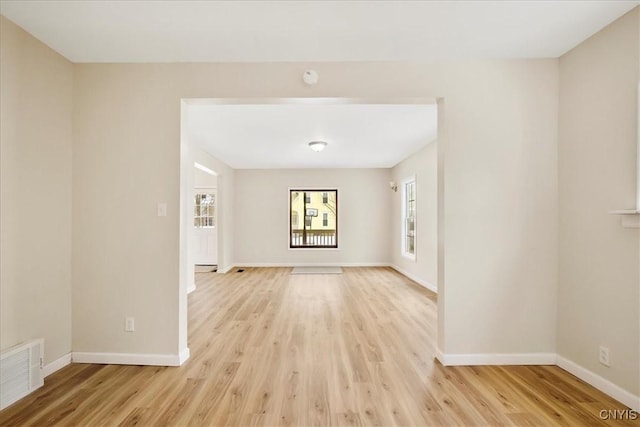 spare room featuring light hardwood / wood-style floors