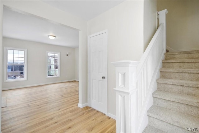 stairs with wood-type flooring