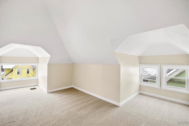 bonus room featuring carpet and lofted ceiling