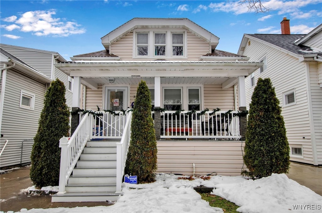 bungalow-style house featuring covered porch