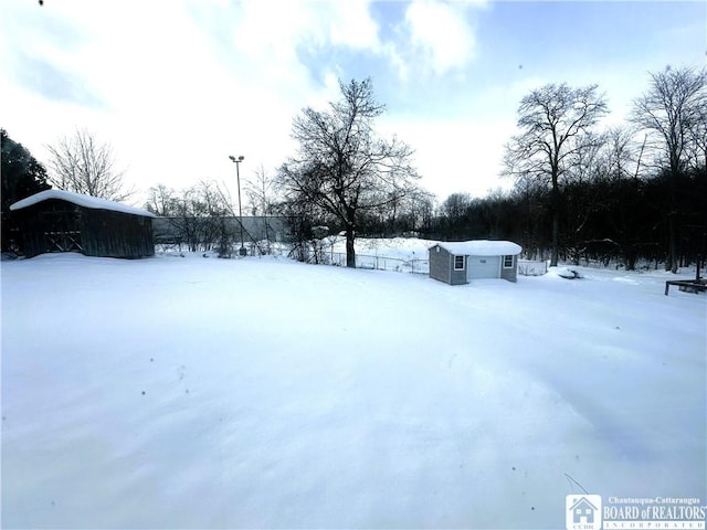 view of yard covered in snow