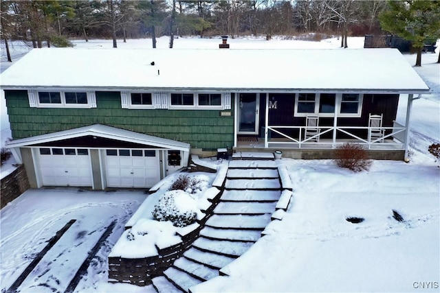 view of front of home with a garage and covered porch