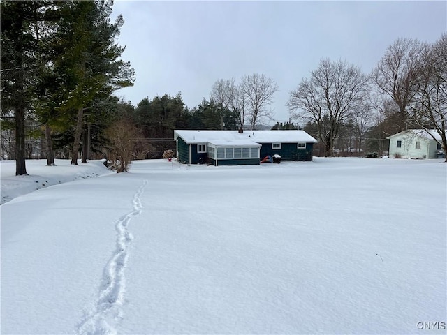 view of yard layered in snow