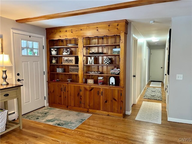 entryway with baseboard heating and light hardwood / wood-style flooring