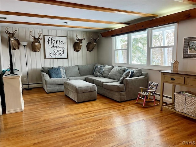 living room with beamed ceiling, a baseboard radiator, and light hardwood / wood-style floors