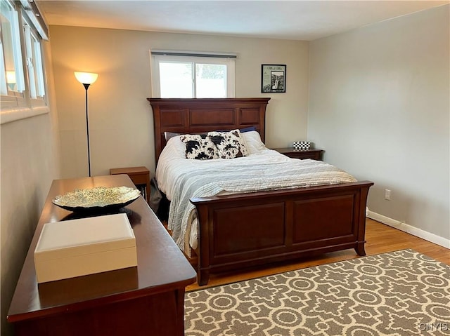 bedroom with hardwood / wood-style floors