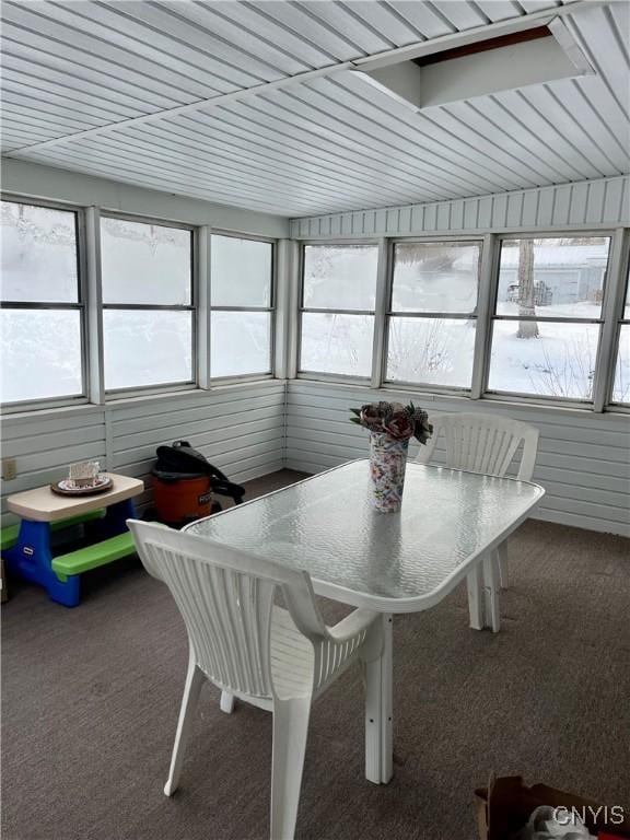 sunroom featuring lofted ceiling