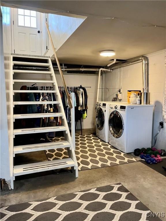 laundry area with washing machine and clothes dryer