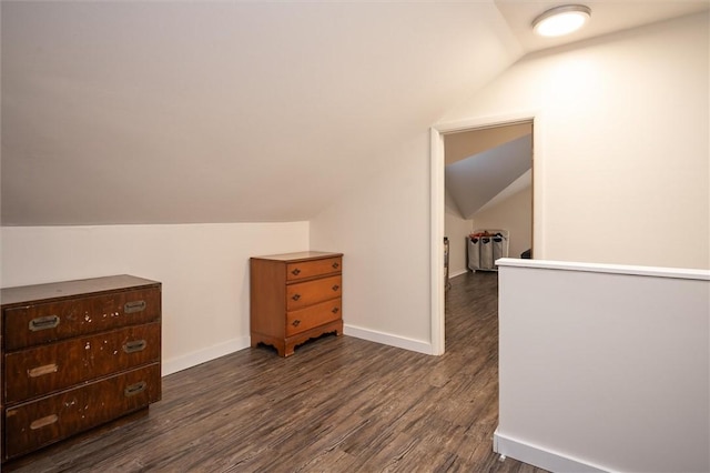 bonus room featuring dark wood-type flooring and lofted ceiling