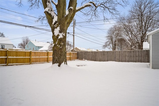 view of yard covered in snow