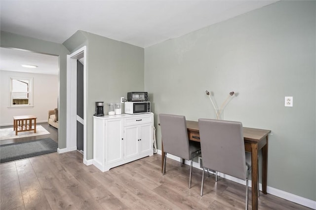 dining room featuring light wood-type flooring