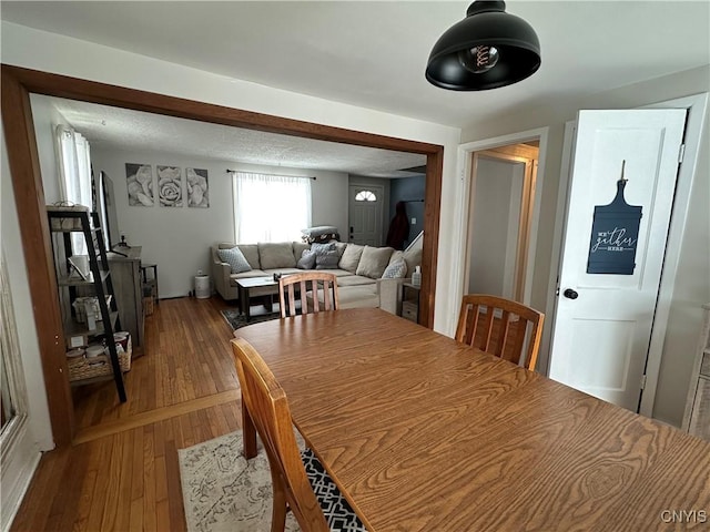 dining area with wood-type flooring