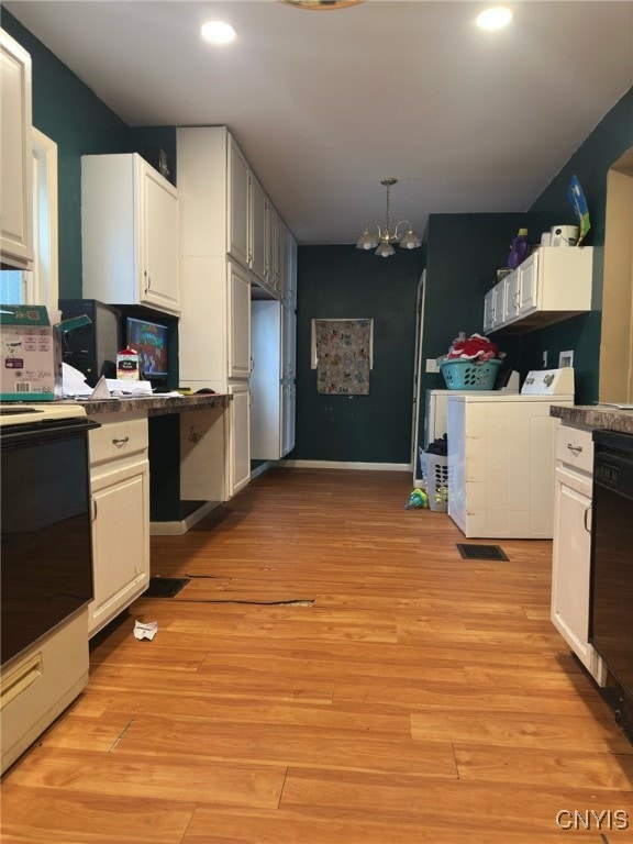 kitchen featuring white cabinets, light hardwood / wood-style flooring, dishwasher, and washer and clothes dryer