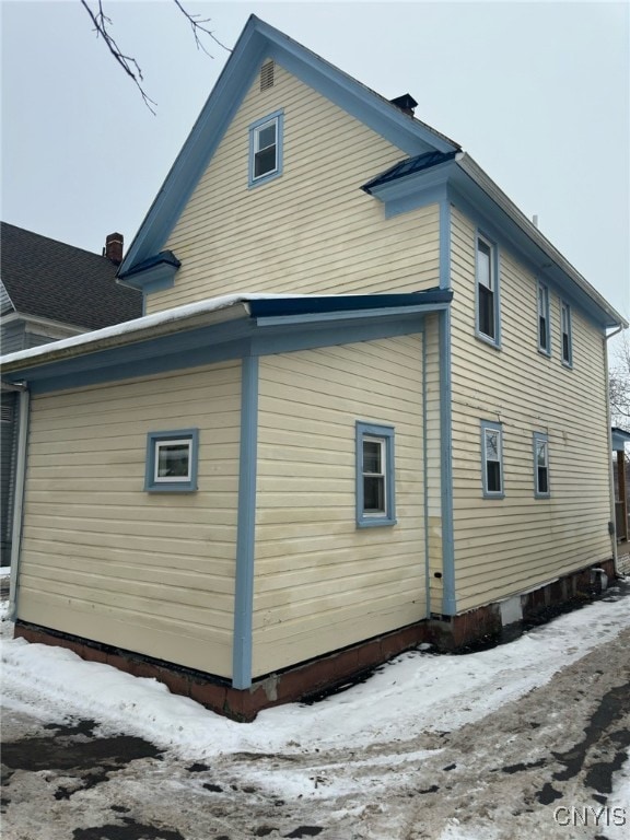 view of snow covered property