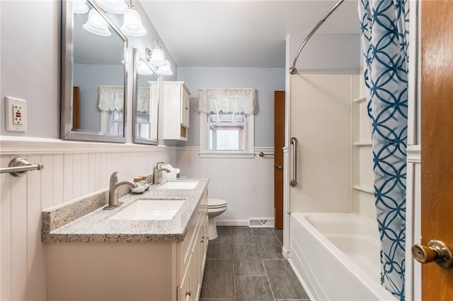 full bathroom with toilet, vanity, wood walls, and shower / bath combination with curtain