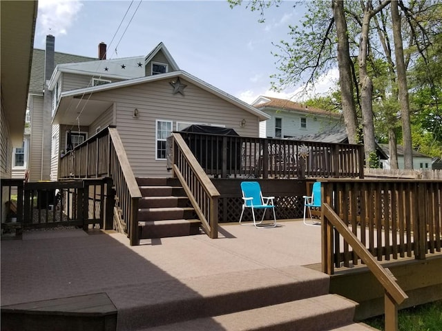 rear view of house with a wooden deck