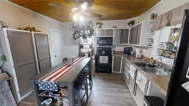 kitchen with wood ceiling, black appliances, dark hardwood / wood-style floors, crown molding, and sink