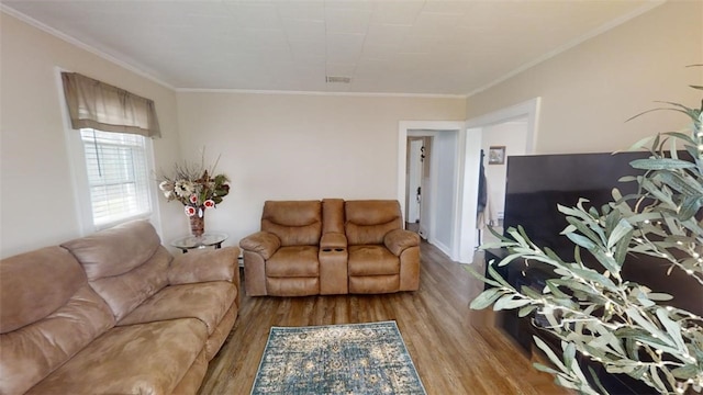 living room with crown molding and light hardwood / wood-style flooring