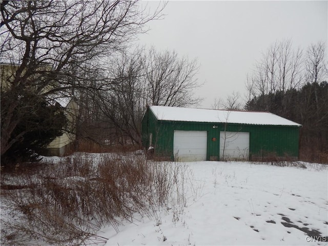 view of snow covered garage