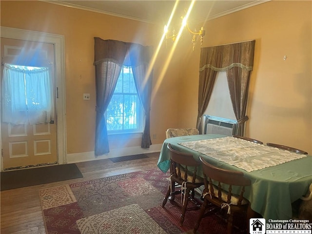 bedroom with an inviting chandelier, ornamental molding, and hardwood / wood-style floors